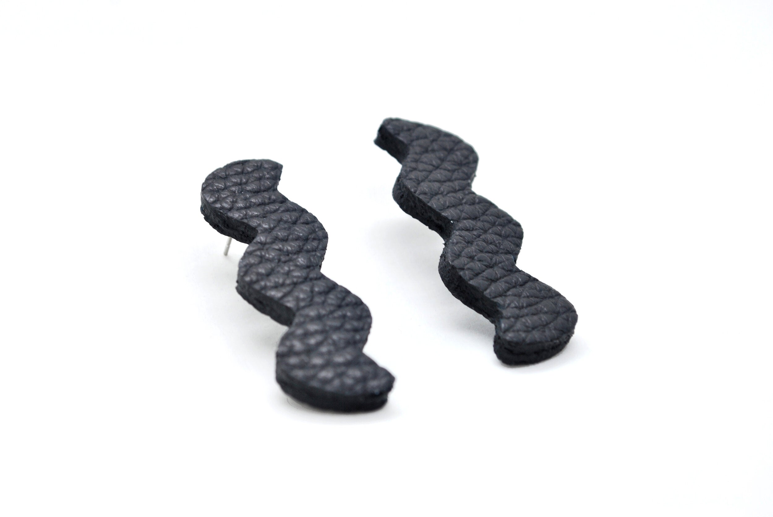 memphis style modern art earrings in textured leather.