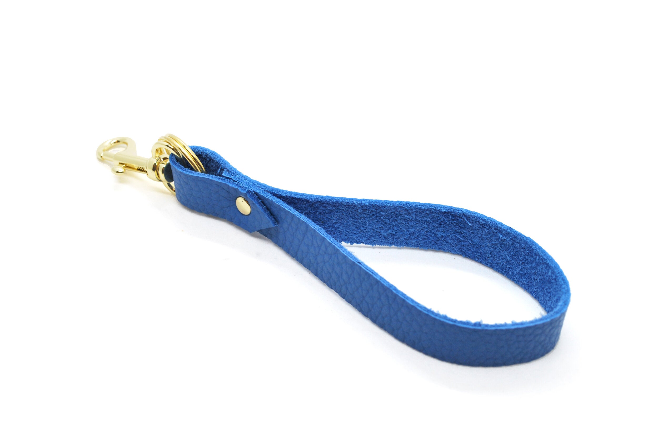 third anniversary gift wrist loop keychain in matisse blue with gold hardware.