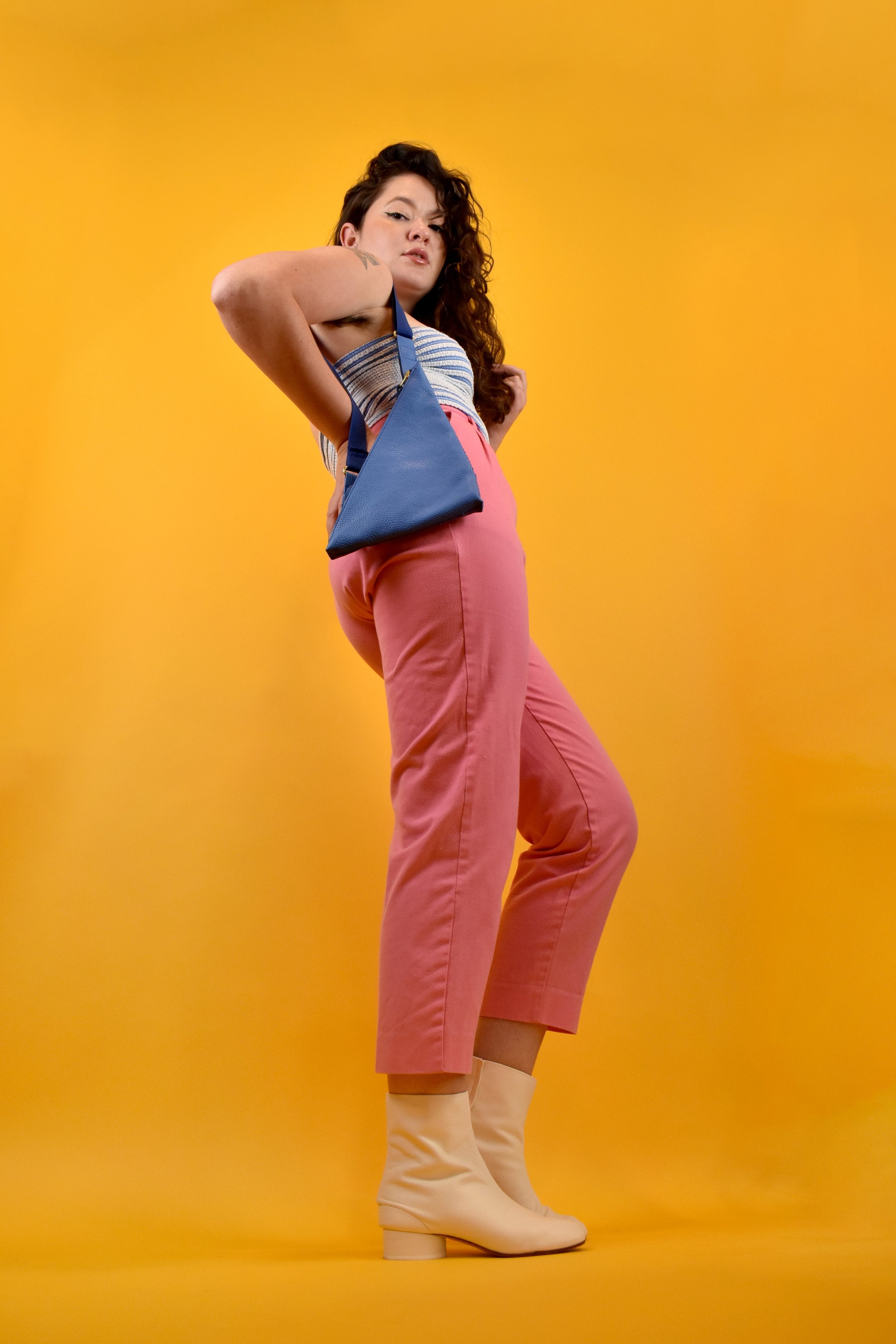 a person shown standing with a sling bag perfect for disney in princess blue ready for adventure crossbody