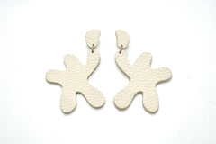 big, bold star shaped statement earrings in textured ivory white leather