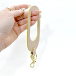 hand holding chartreuse leather wristlet keychain key fob leather modern bold accessory