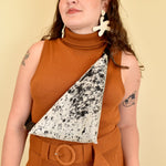 a girl wears a cow sling bag for hiking essentials bag small leather sling bag crossbody cowhide leather purse cowgirl gift for sister in law sling purse with card pocket