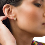 model wearing crystal quartz studio stud earring birth stone gift for her gemstone earrings gold geometric studs