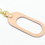 modern leather keychain with cutout finished with a gold key ring and clasp in vegetable tanned and amethyst lavender leathers