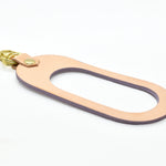 oval shaped leather keychain in lavender pastel leather rawhide veg tan leather