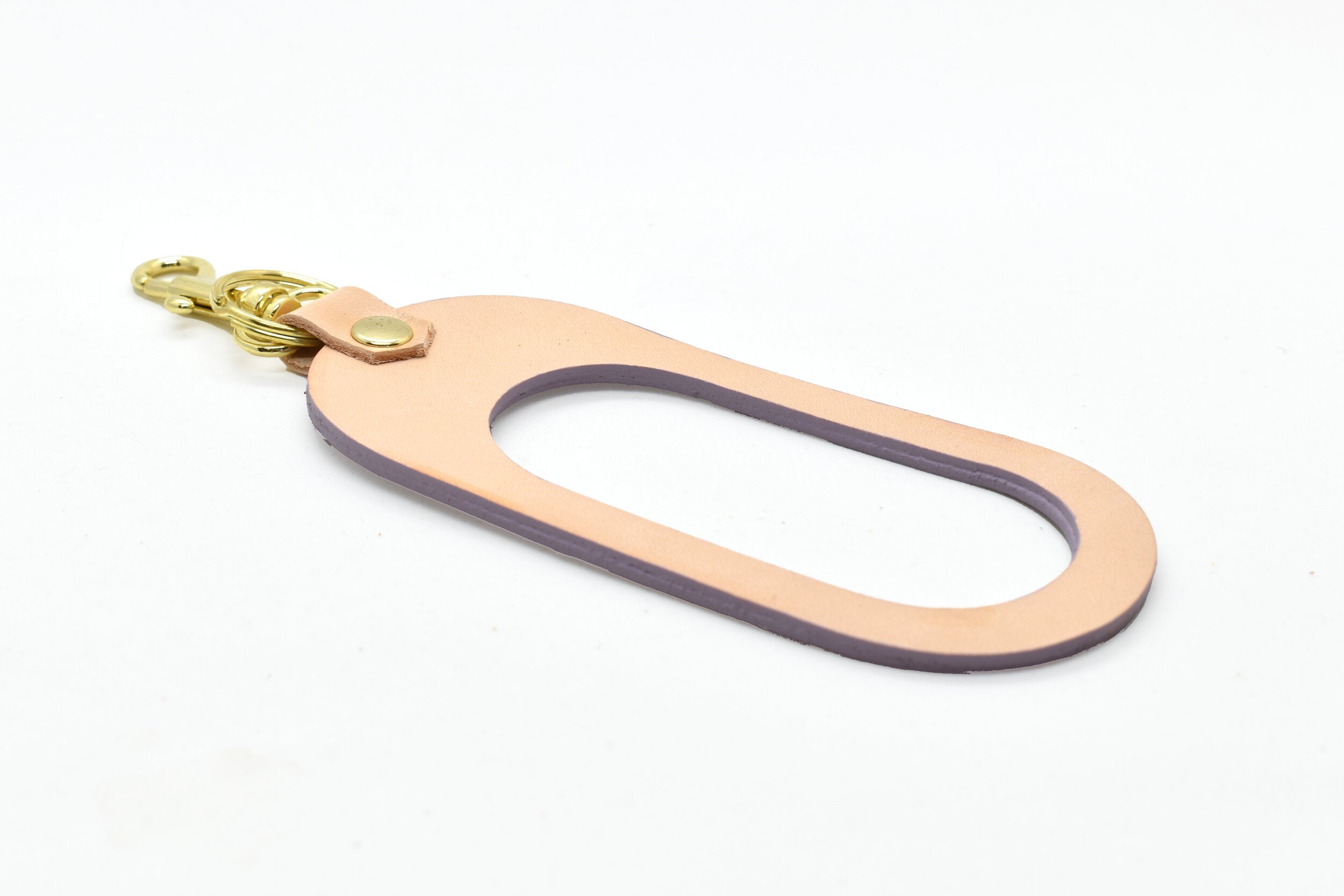 oval shaped leather keychain in lavender pastel leather rawhide veg tan leather