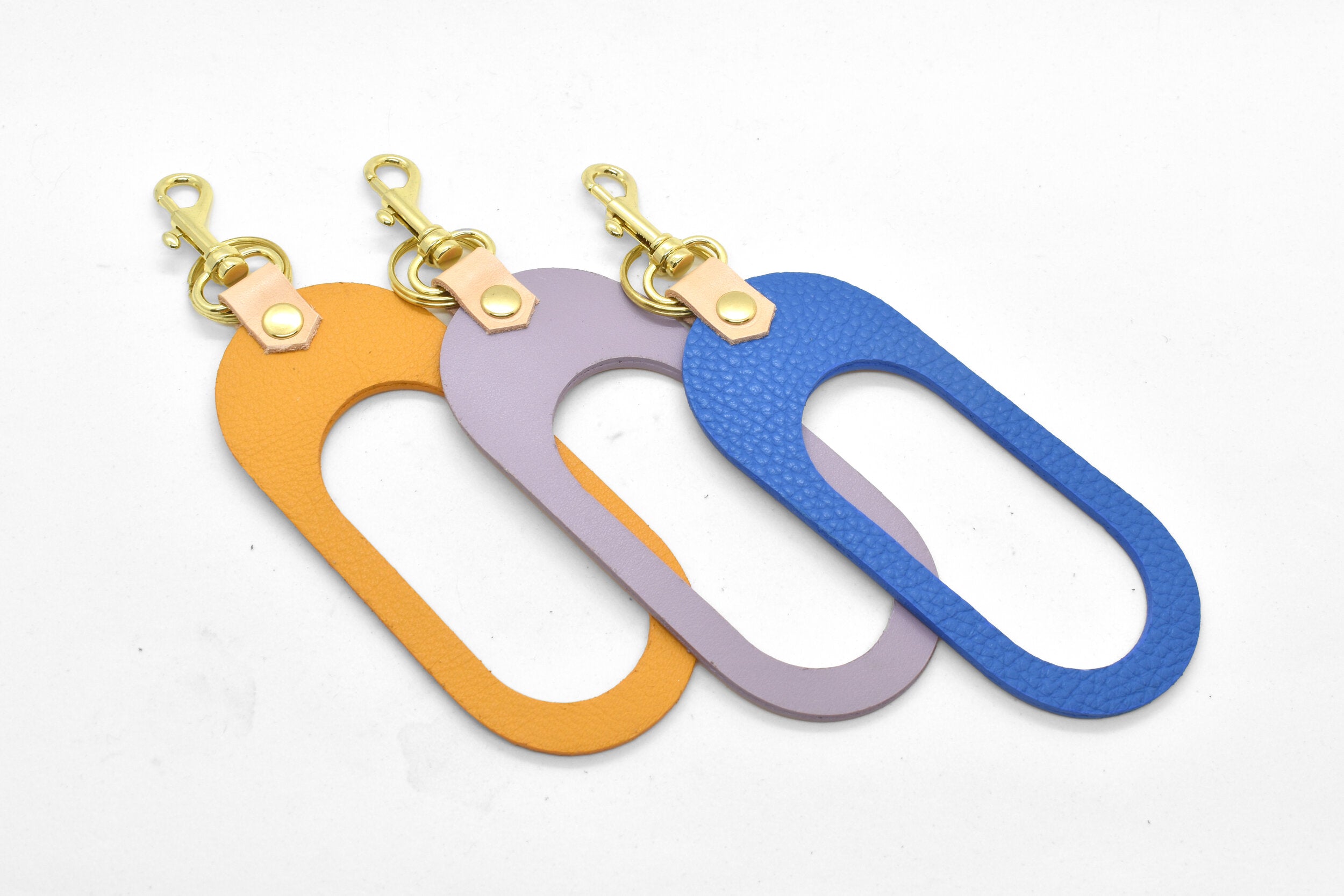 marigold lavender and matisse blue leather cut out keychains with gold hardware keyring