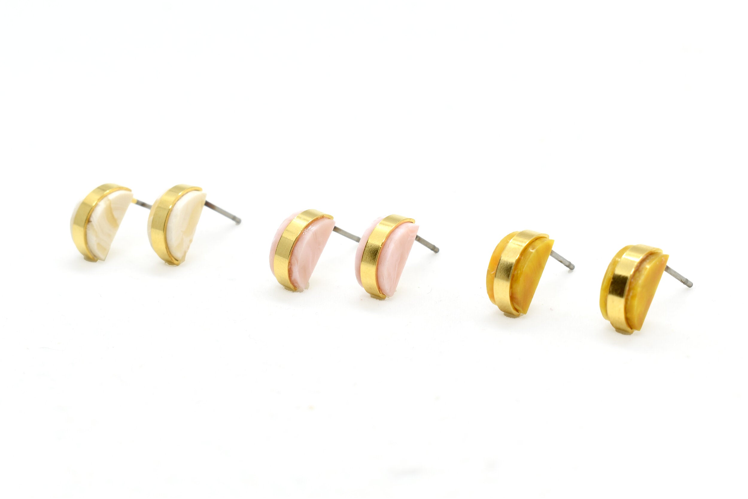 crystal quartz, rose quartz pink, and marigold yellow stud earrings in golden half moons.
