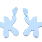 star shaped leather cutout dangle earrings in periwinkle blue.