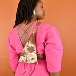 a woman wearing a speckled leather bag trendy accessory minimal sling bag leather gift for sister in law favor for bachelorette party