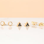 geo studs collection in three new colorways lined up: dalmatian hexagon, night sky terrazzo triangle, jewel tone half moon terrazzo