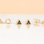 new terrazzo gold geometric geo studs line in dalmatian terrazzo, night sky terrazzo, and jewel terrazzo by cold gold photographed on marble