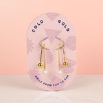 pink cold gold card displaying gold freshwater baroque pearl drop earrings