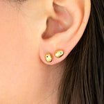 model with double lobe piercing wearing 14k gold plated baroque pearl studs encrusted with colorful CZ microgemstones