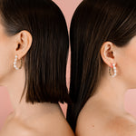 models back to back wearing baroque pearl versatile hoop earrings