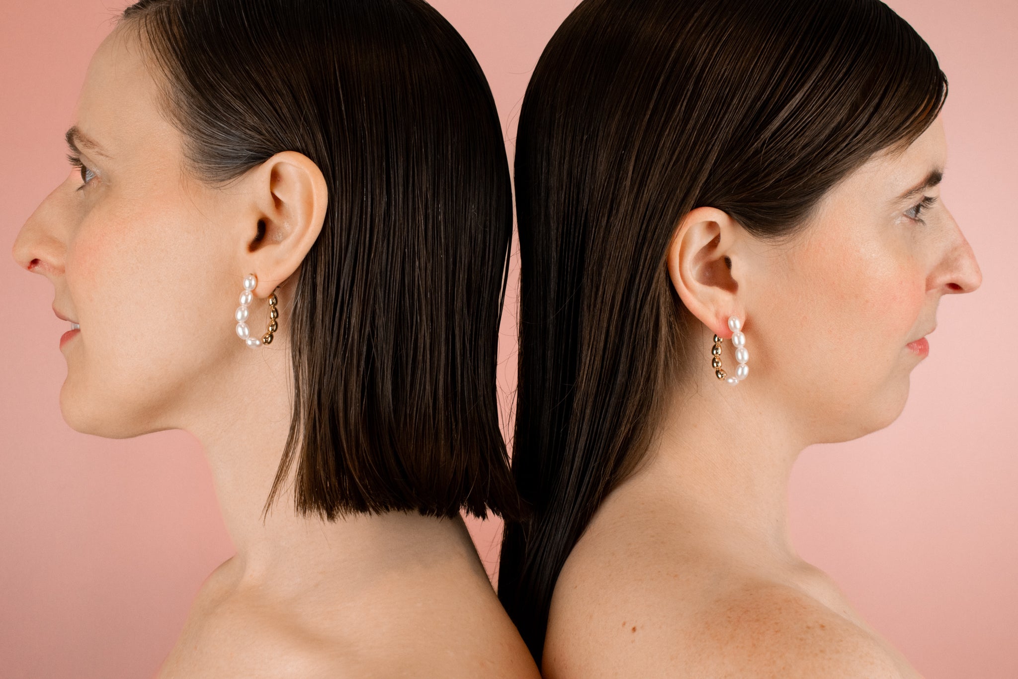 models back to back wearing baroque pearl versatile hoop earrings