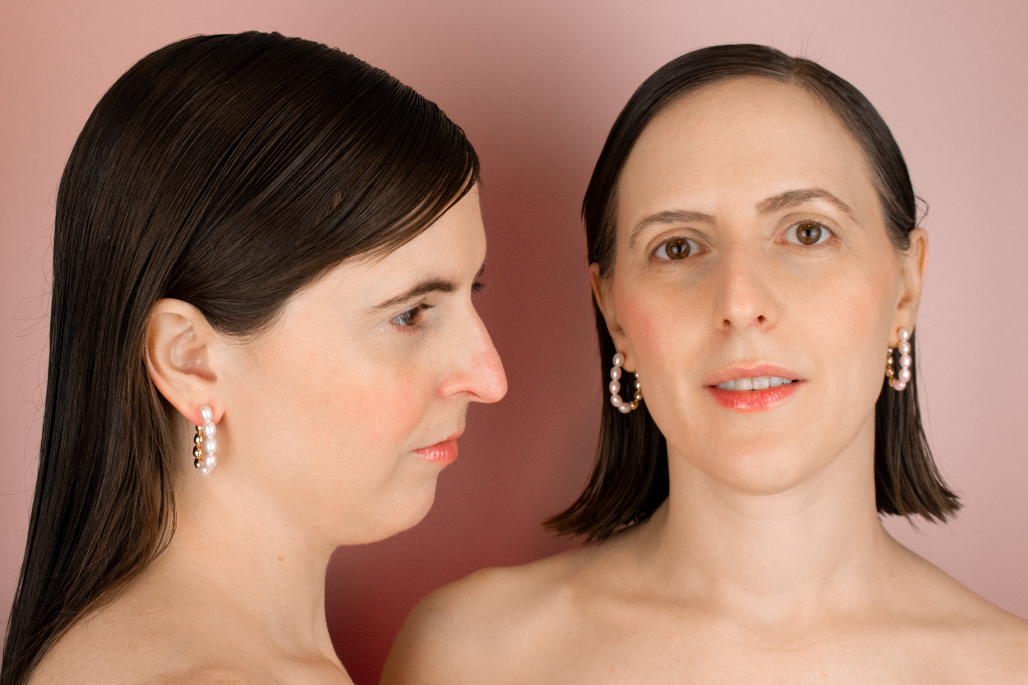 female models wearing baroque pearl and gold looped earrings with front to back design and sterling silver posts