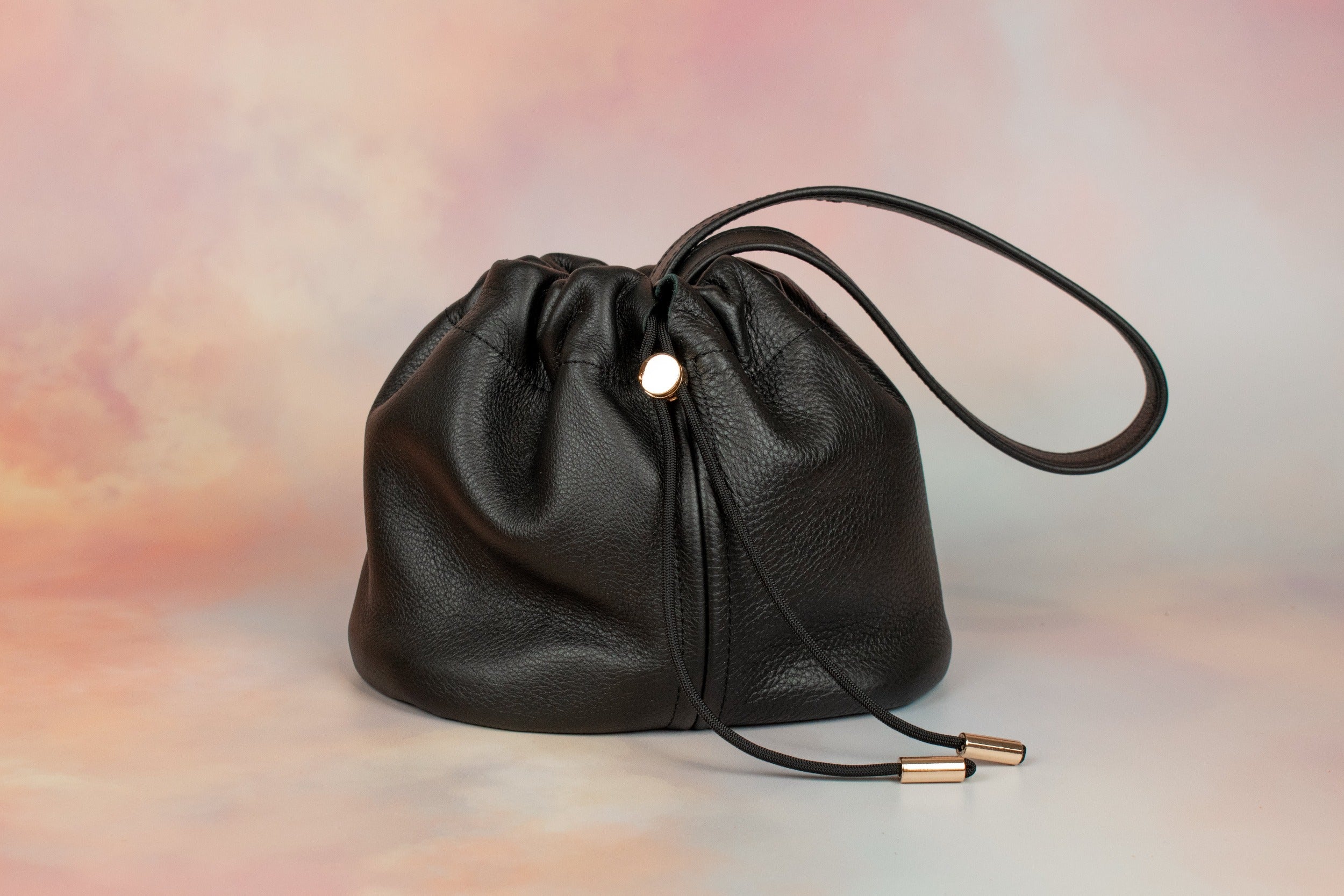 pebbled grain drawstring bucket bag with gold hardware and scrunch top