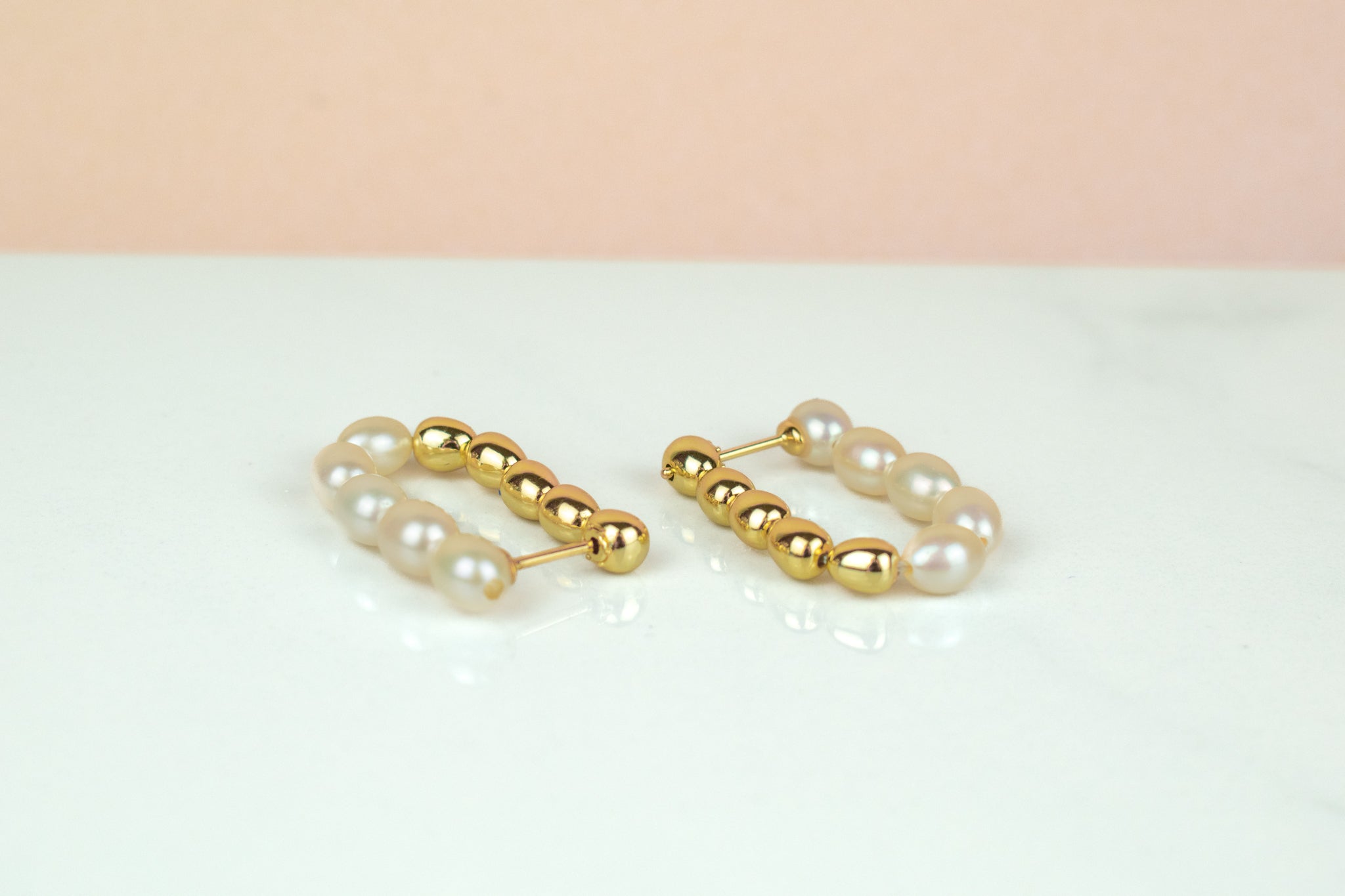 string of baroque freshwater pearl hoop earrings