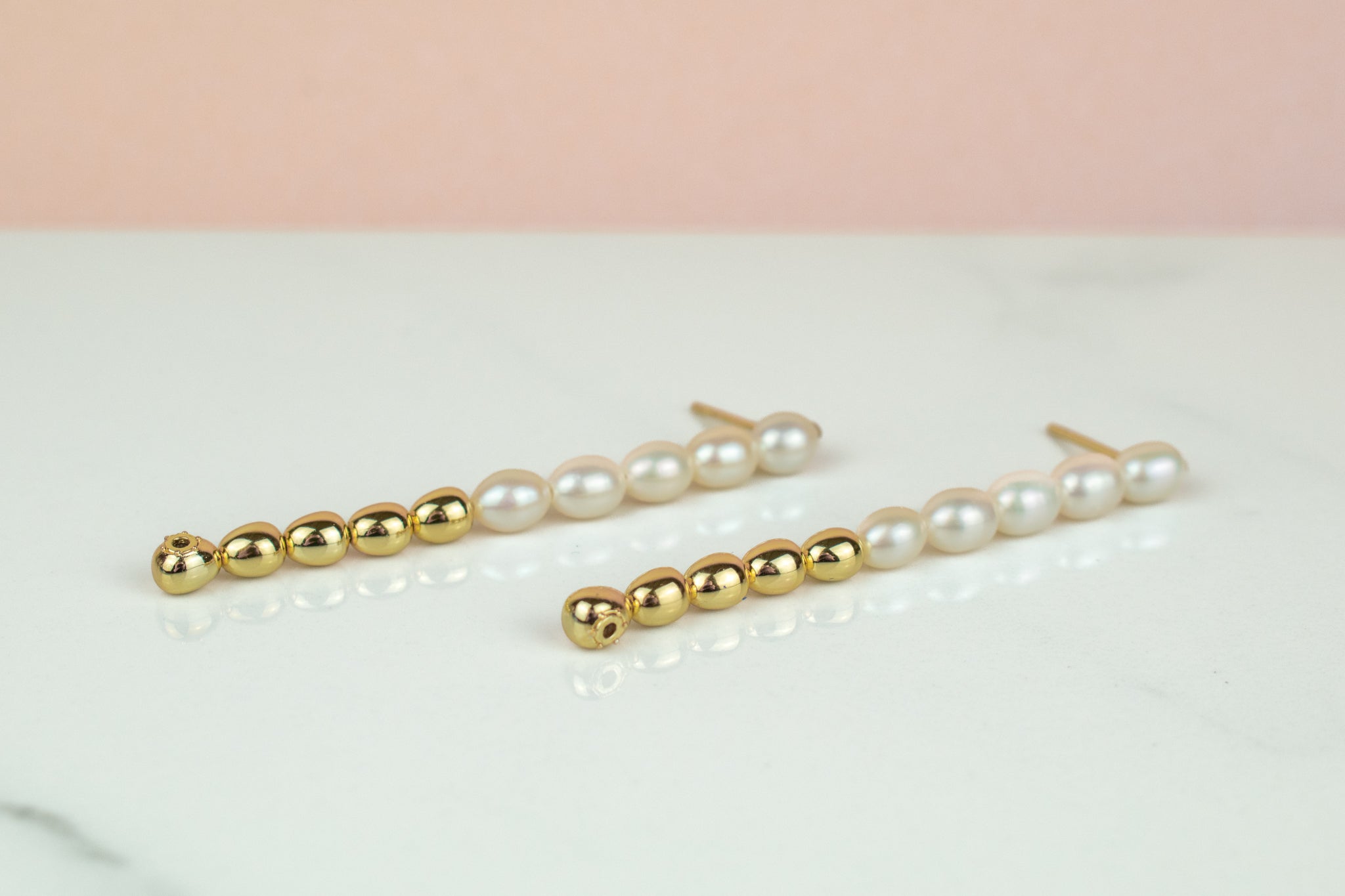 versatile dangly pearl and gold drop earrings