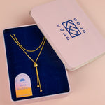 adjustable gold bolo tie necklace in cold gold branded jewelry box