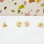 three available shapes of white terrazzo gold geometric studs: triangle, hexagon, and half moons