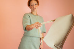 model swinging chic ivory leather shoulder bag