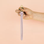 models hand displaying pale purple leather wristlet