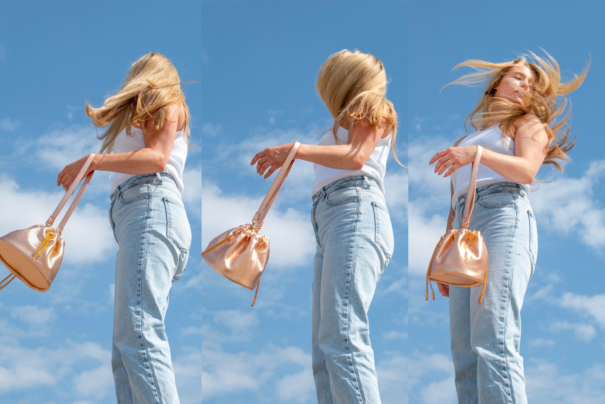 model flipping hair carrying rose gold medium sized shoulder bag with drawstring closure