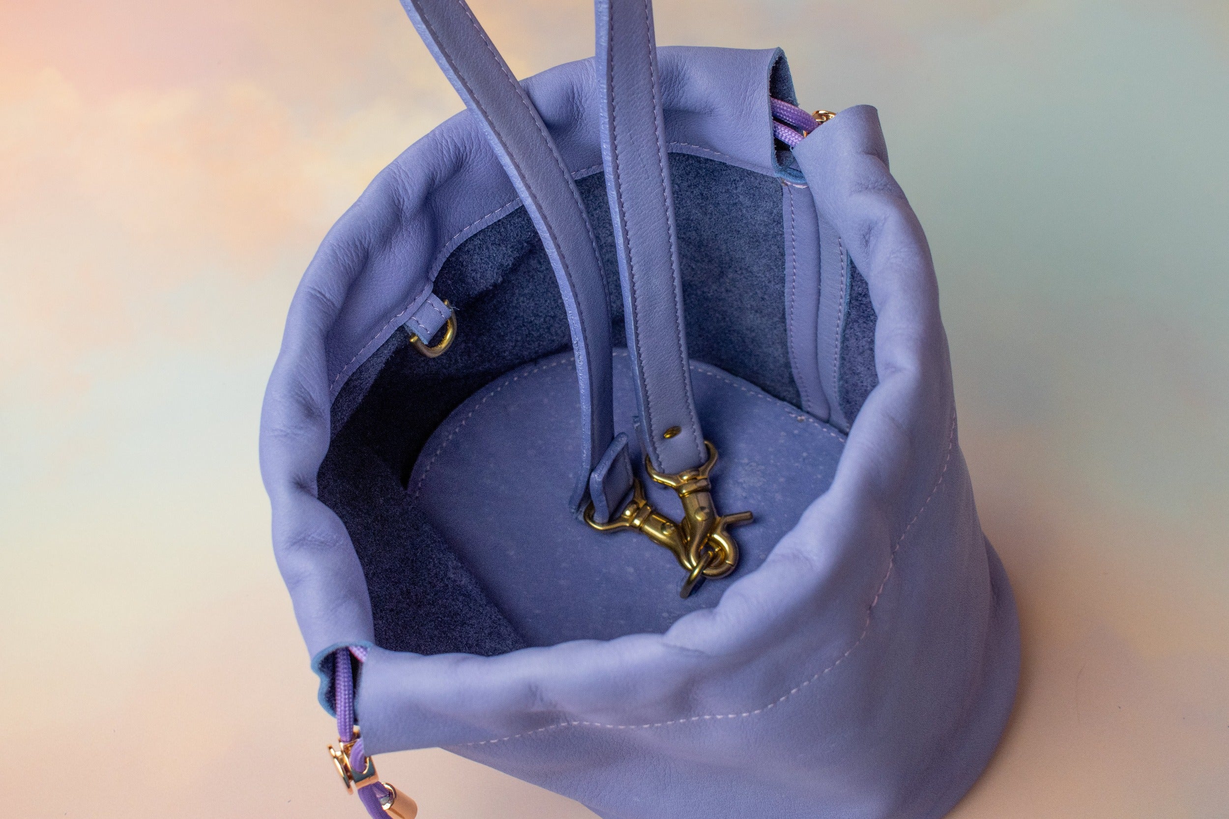 interior of 90s nickelodeon purple leather handbag with adjustable clasp