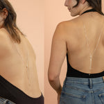 model wearing backless bodysuit displaying long sterling silver lariat chain necklace down back