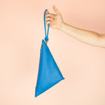 bright blue genuine leather clutch wristlet hanging from matching blue handmade leather keychain