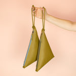 matching olive leather clutch wristlets hanging from knot keychains