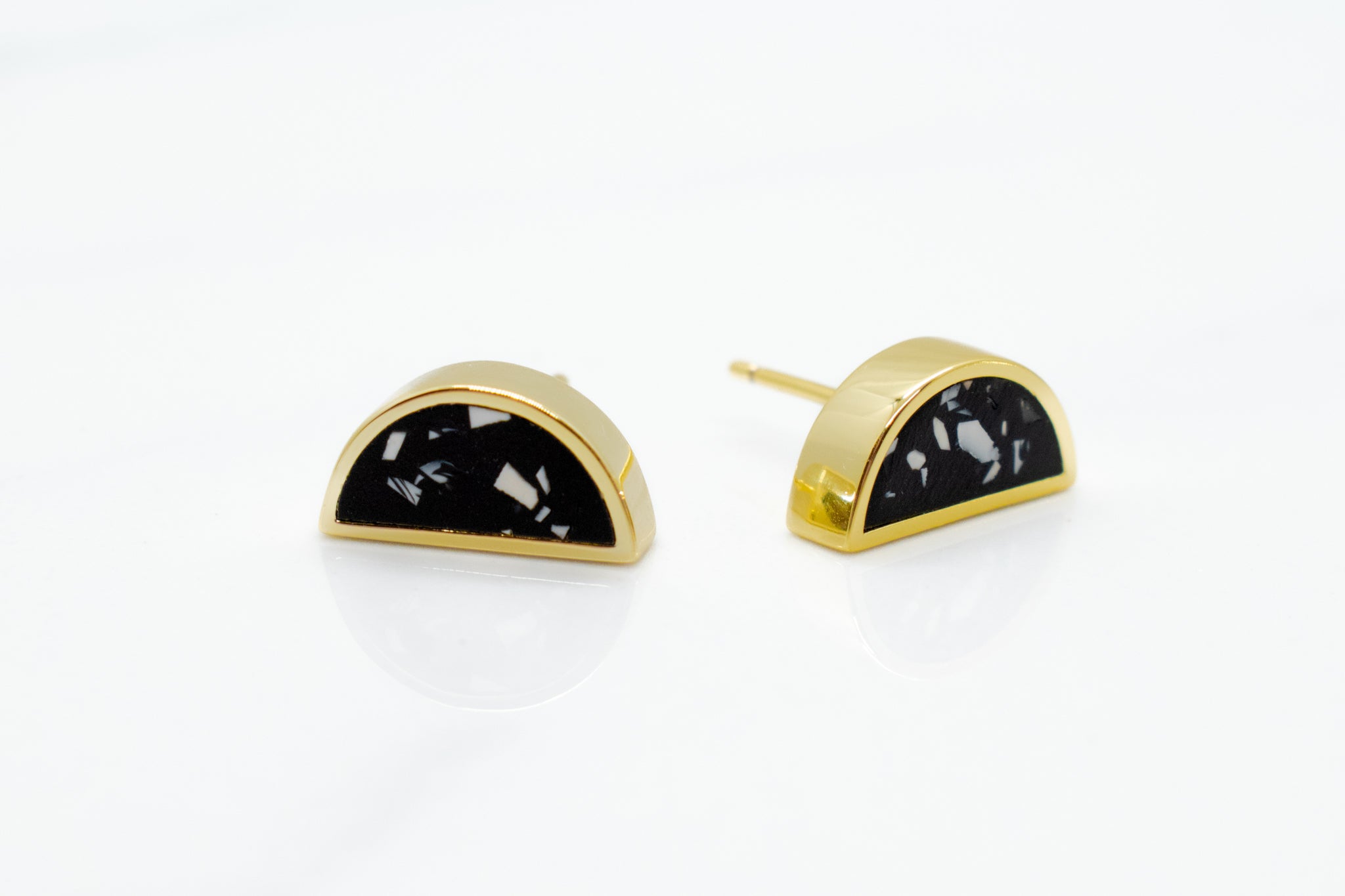 14k gold plated half moon earrings with matte black and contrasting chips of white clay in terrazo design