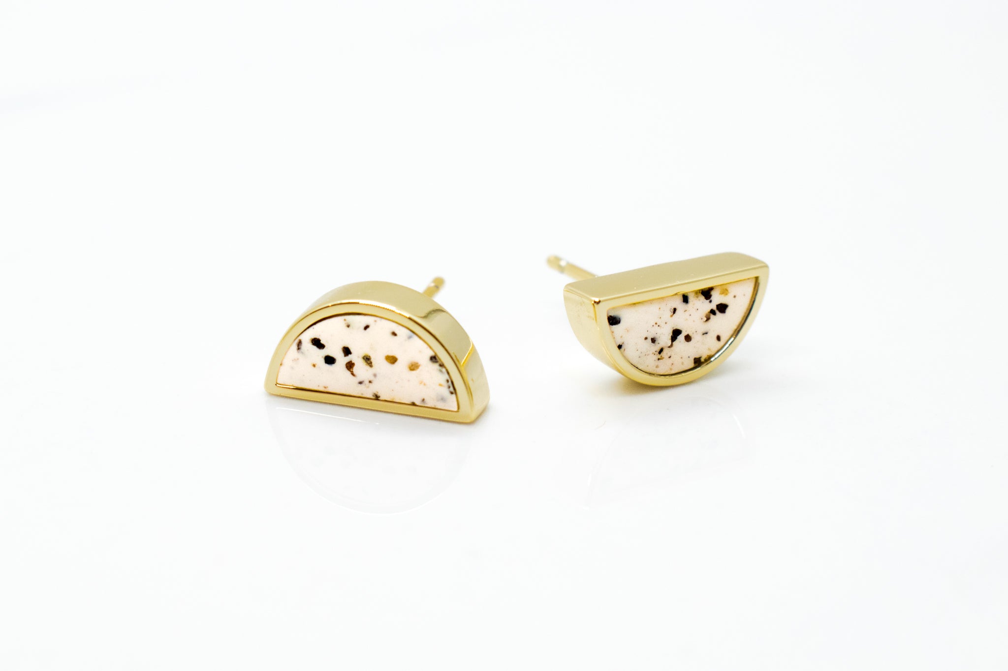 14k gold-plated moon earring handmade with white clay and flecked with specks of black gray and brown