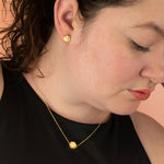 model wearing matching hexagon terrazzo necklace with delicate cable chain and hexagon earring