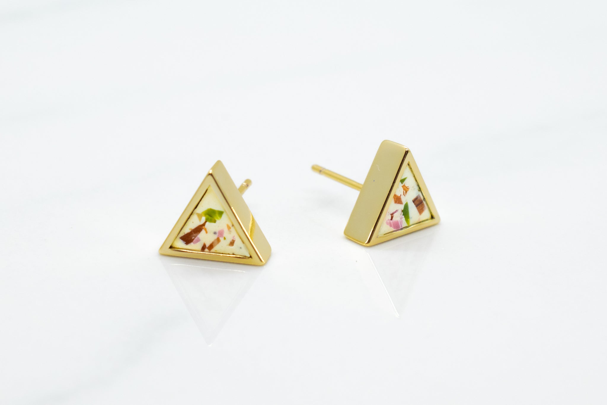 everyday gold triangle earrings in white and multicolored terrazzo pattern