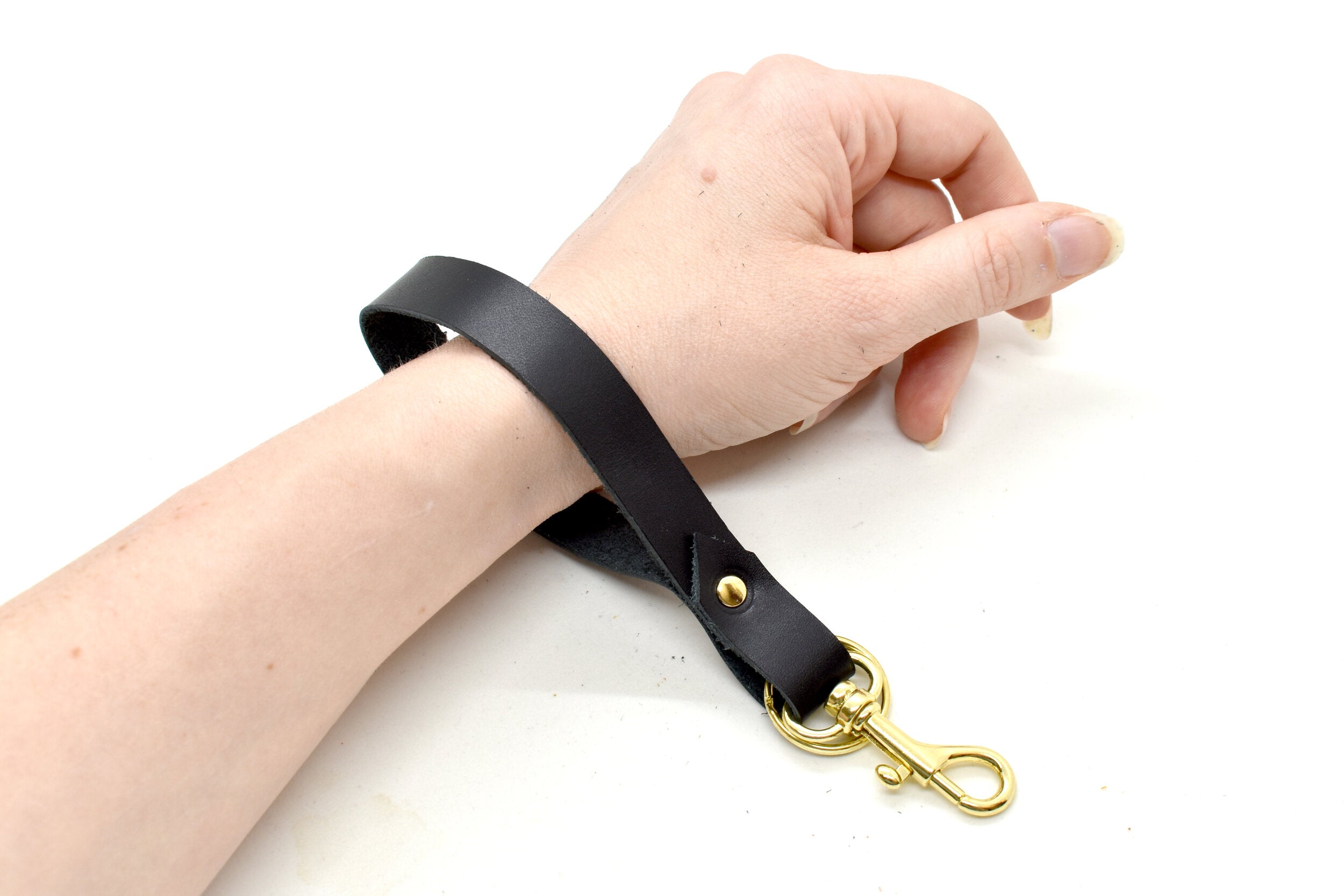 authentic leather in black with gold keyring and handbag clasp.