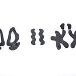 three pairs of irregular shape leather earrings in black onyx.