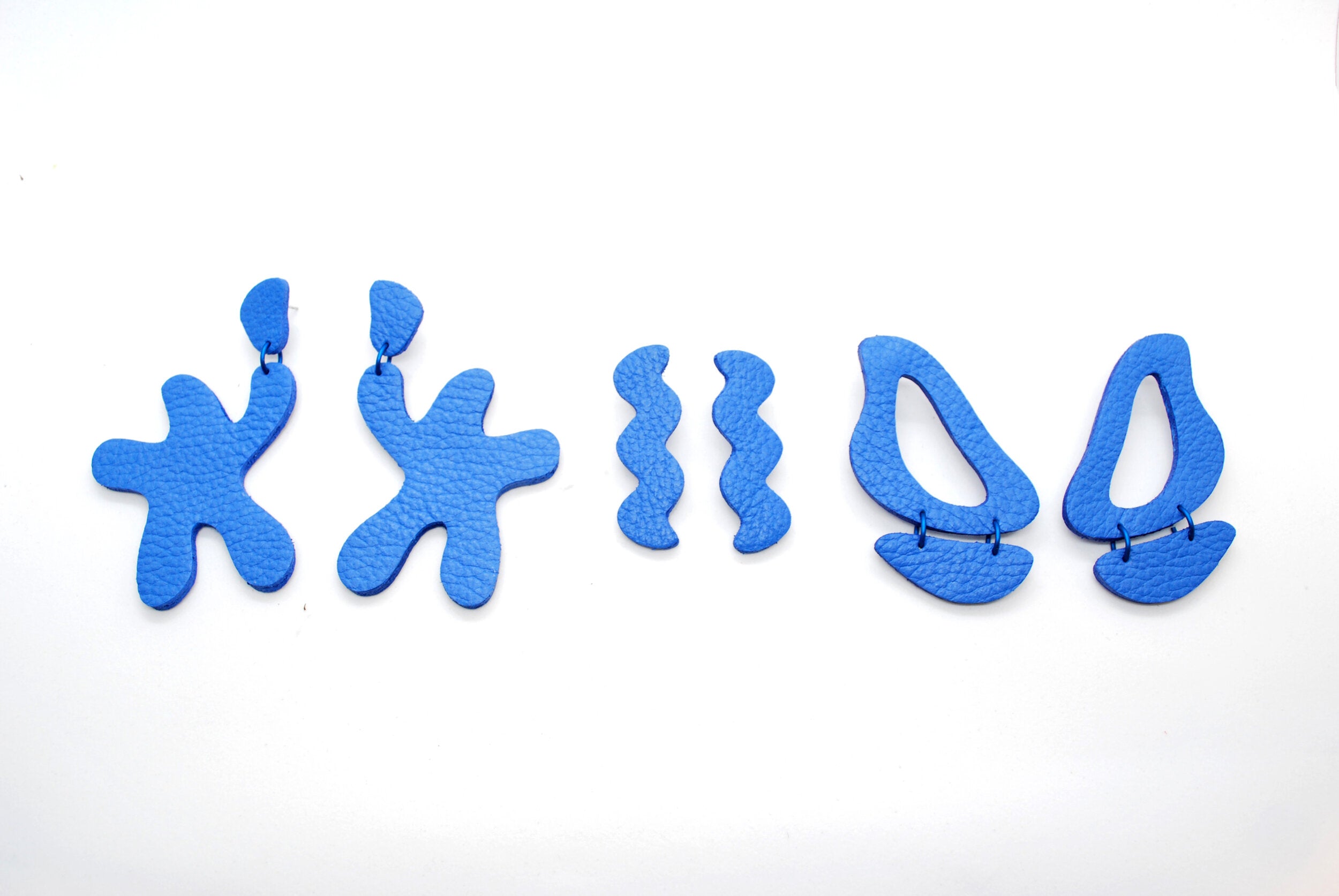 monochromatic real leather cutout earring sets in blue lightning.