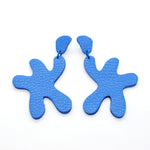 oversized, organic cutout leather earrings in matisse blue.
