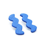 memphis style modern art ear rings in textured blue leather.
