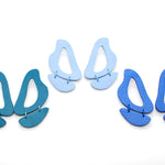 cutout leather inferno statement earring sets in turquoise, periwinkle, and blue.
