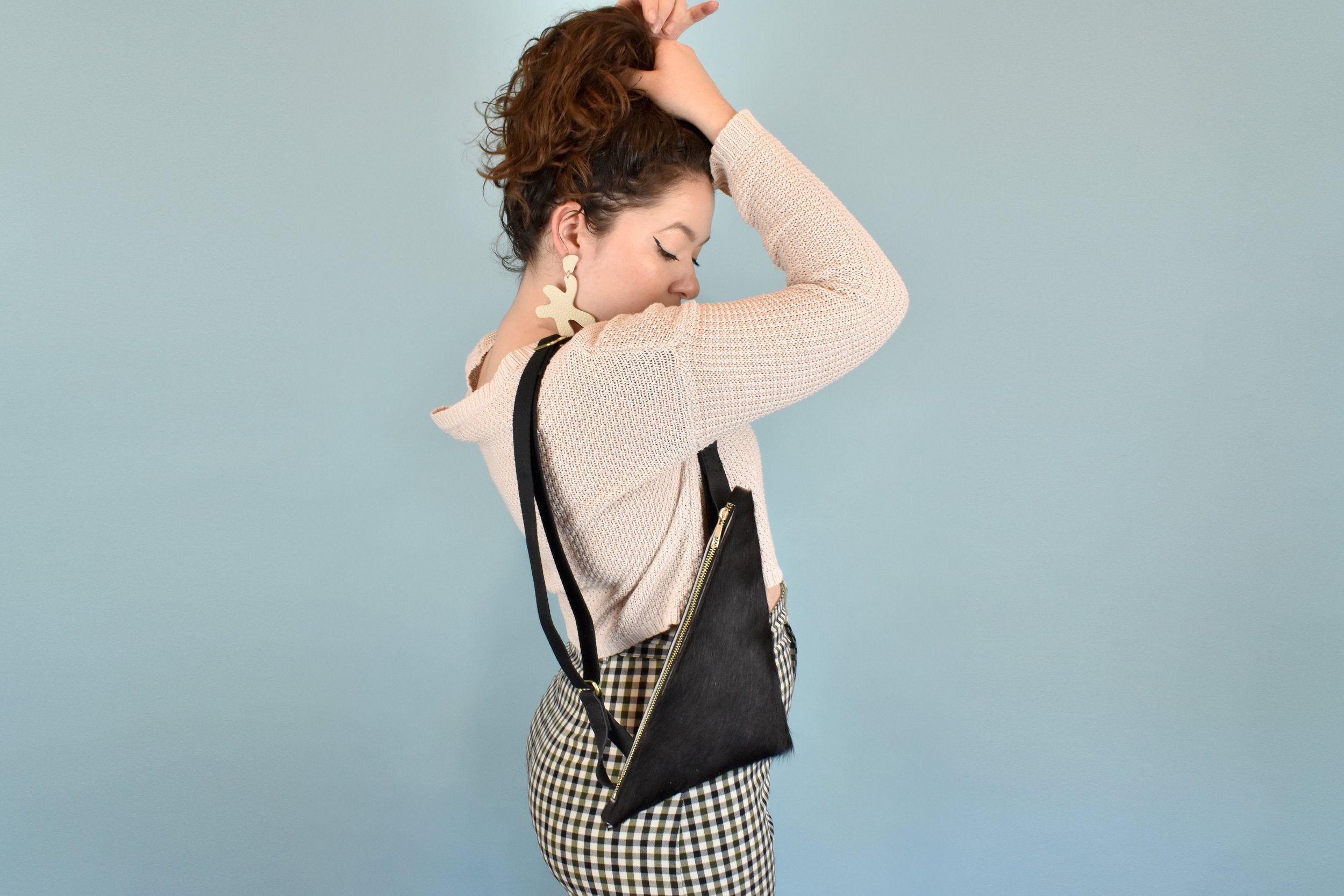 The TriSling: A Leather Crossbody Sling Bag / Wristlet Clutch in Black and White Hair-On-Hide Leather