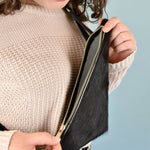 unzipping of black hair on hide western purse