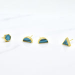 three pairs of geometric earrings shown on a white background, geometric stud set in 14k gold plated sterling silver and aqua marbled clay