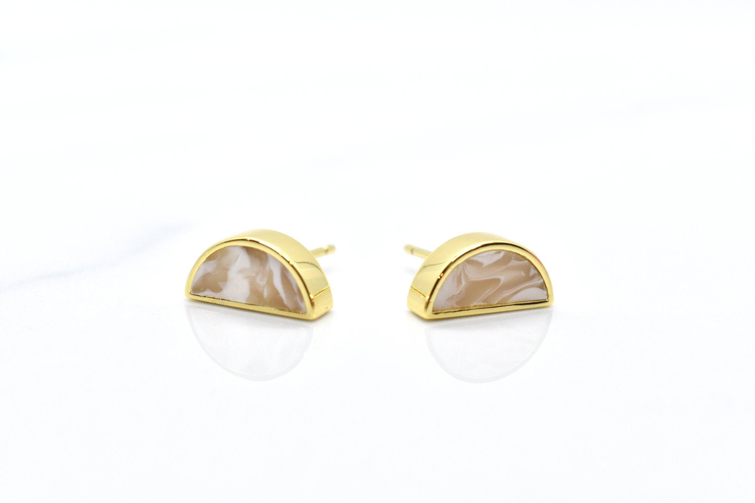 gold half moon stud earring set in crystal quartz.