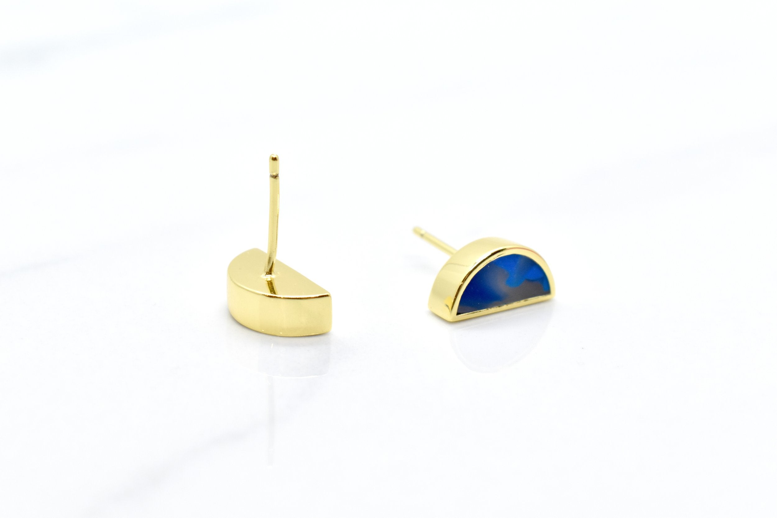 deep sapphire blue marbled tiny halfmoon earrings with 14k gold plating on white background