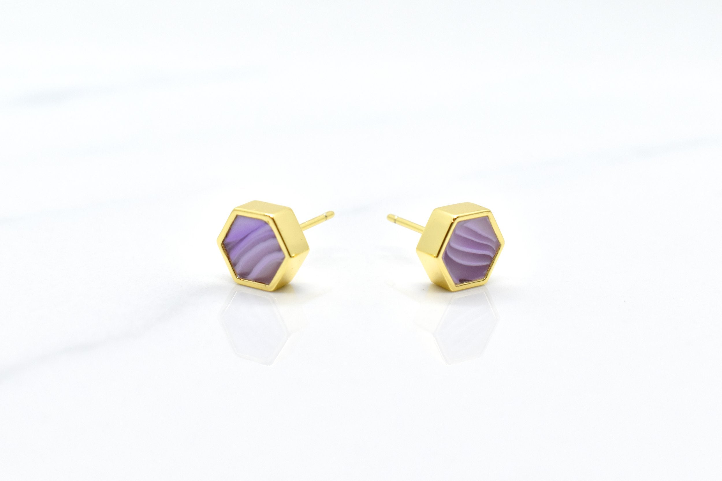 a frontal view of lavender and gold honeycomb earring stud set