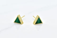 gold triangle stud earring set in emerald gemstone like clay against a white background